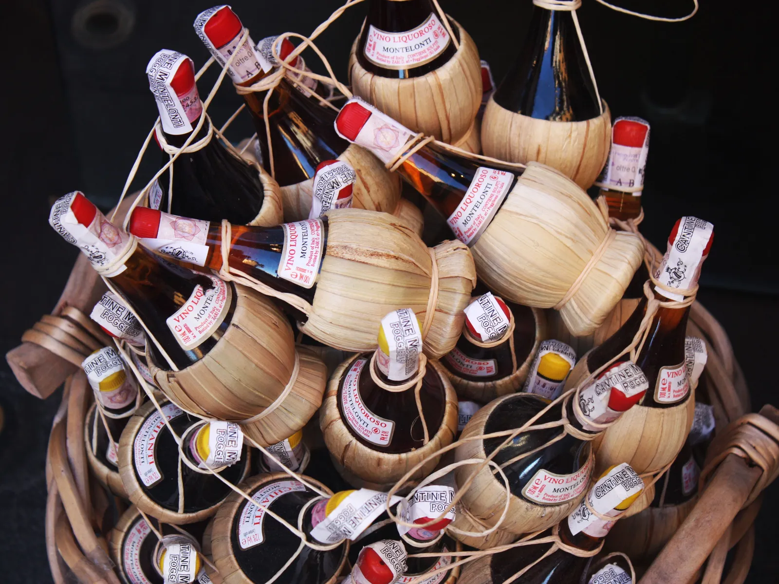 Bottles of Tuscan wine lined up ready for a tasting in Chianti, Italy